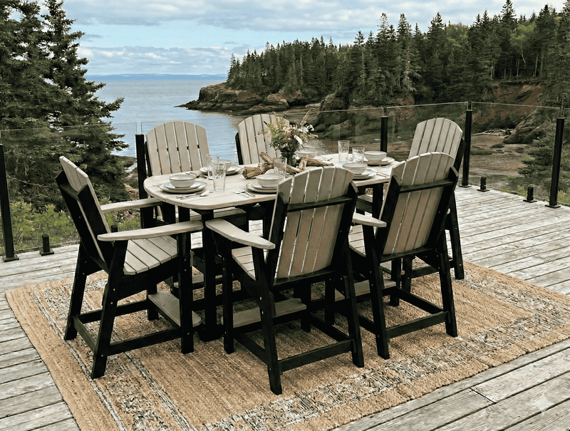Krahn outdoor 6' bistro set on a wooden deck with a scenic background of trees and water in New Brunswick