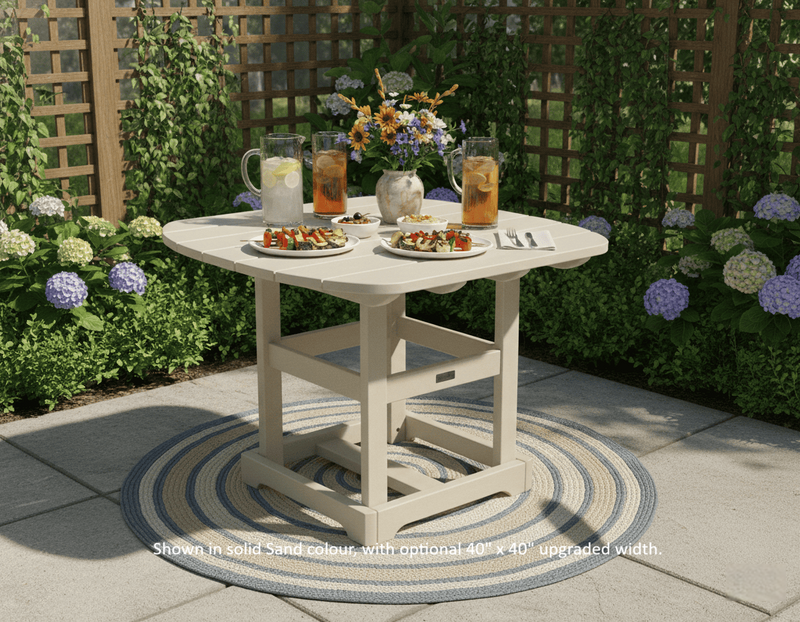 Krahn outdoor dining table with drinks and snacks on a patio with plants and flowers in the background