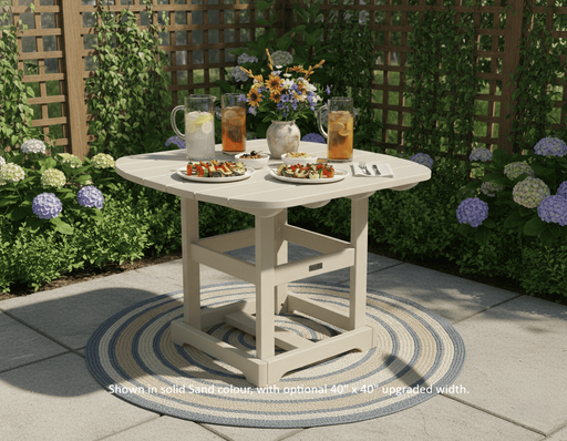 Krahn outdoor dining table with drinks and snacks on a patio with plants and flowers in the background