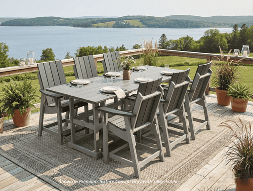 Krahn outdoor poly dining set with gray table and chairs on a deck overlooking a scenic landscape.