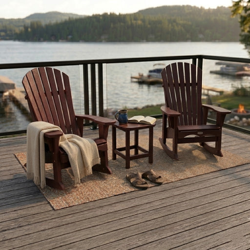 Two Sangria Krahn Adirondack Patio Rockers with a Krahn end table on a deck overlooking the water