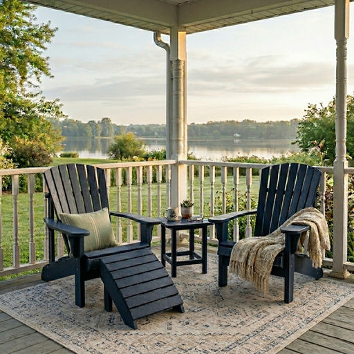 Two navy Krahn Adirondack Classic Chairs with a footrest and end table on a porch setting overlooking a lake