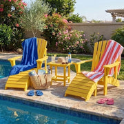 Two yellow Krahn Adirondack Classic chairs with footrests and end table in a backyard pool setting 