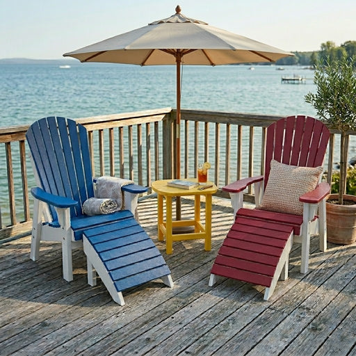 Two Krahn patio chairs with foot rests and an end table in Acadian colours on a deck overlooking the water