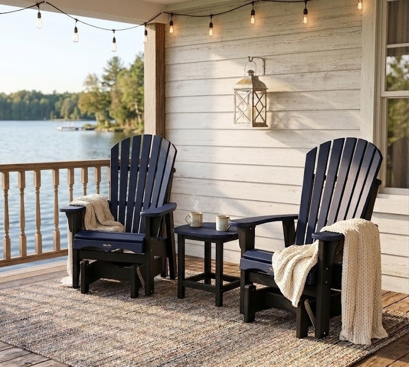 2 Krahn outdoor poly adirondack gliders on a porch by a lake