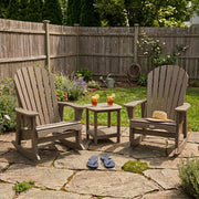 Two Weathered Wood Krahn Patio Rockers in a backyard patio setting