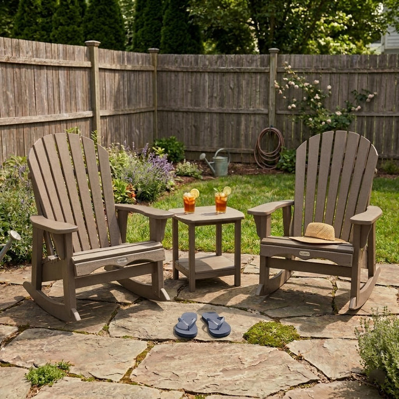 Two Weathered Wood Krahn Patio Rockers in a backyard patio setting