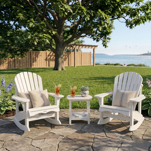 Two White Krahn Adirodack Rockers with Krahn end table in a backyard setting overlooking the water. 