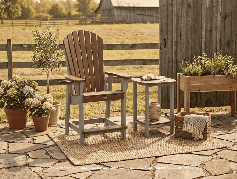 Outdoor patio setting with Krahn poly bistro chair, recycled plastic side table, and potted plants on a stone patio.