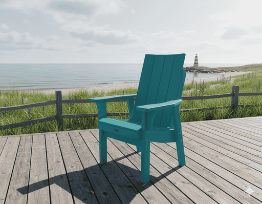 Krahn Modern Dining chair on a wooden deck with a scenic view of a lighthouse and beach.