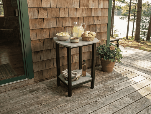 Krahn End Table Bistro set up a s serving table on a deck, by a cottage with a lake in the background