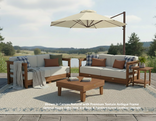 Krahn outdoor deep seating patio set with two loveseats, a coffee table, and a Frankford cantilever umbrella on a wooden deck with a scenic background.