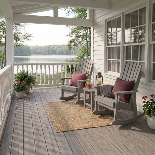 Two Krahn porch rockers in silver with Krahn end table on a porch 