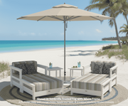 Krahn Deep Seat Ottoman with Matching Armchair in outdoor patio setting, with Frankford Monterey Market umbrella on a beach. Canadian Recycled Poly Furniture.