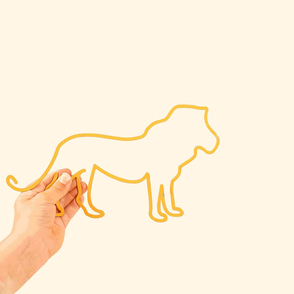 The Lion Line: Regal metal silhouette featuring a playful lion, perfect for adding charm to kids&#39; spaces.
