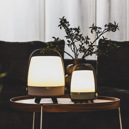 Lite-up Play by Kooduu: JBL-powered speaker and warm white lamp with minimalist aesthetics, brass details, and wooden handle.