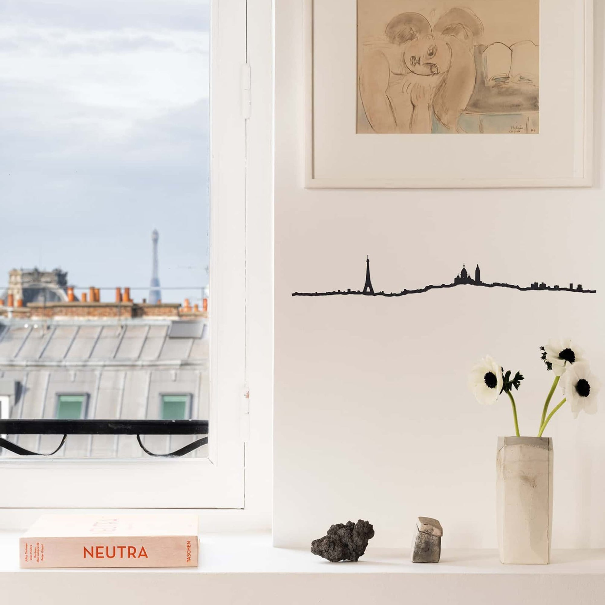 Minimalist Paris Line captures the skyline from the 18th arrondissement, including Sacré-Coeur and La Défense.