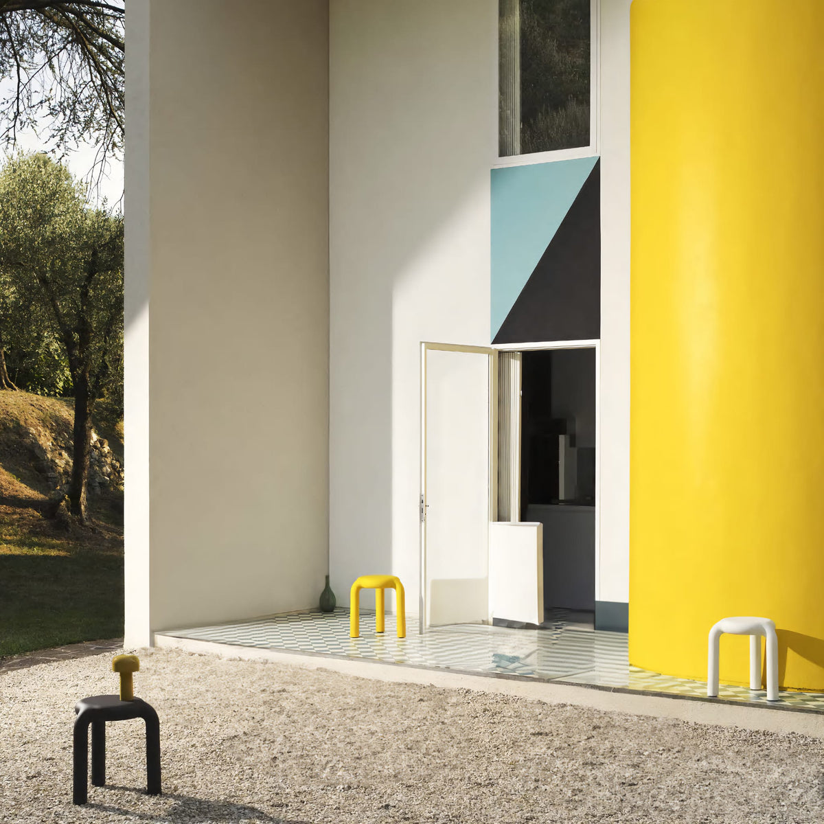 Minimalist Piccolo stool with hollowed-out structure, crafted from durable polypropylene, ideal for versatile spaces.