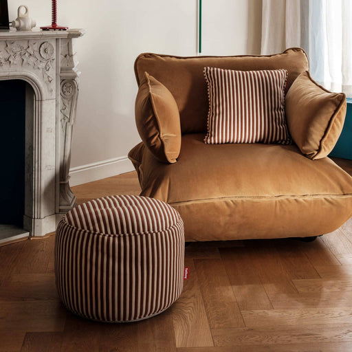 Soft indoor pouf in striped terry fabric, perfect as a footrest, seat, or side table.