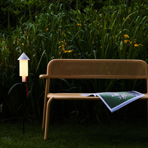 Eco-friendly Fatboy Racket la Surprise solar light with automatic dusk activation and cozy warm glow for your garden.
