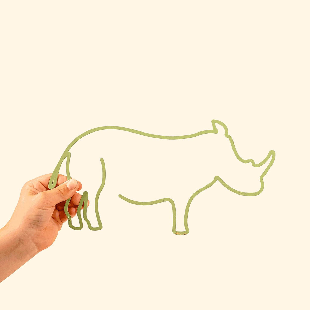 The Rhinoceros Line: Bold metal silhouette featuring a playful rhino, perfect for adding character to kids&#39; spaces.