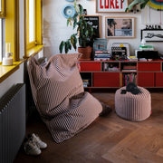 Cozy, compact bean bag with spa-like terry softness and supportive lounging feel.