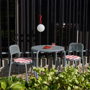Elegant Toní Bistreau table and chairs from Fatboy, offering stackable convenience and modern style for any outdoor setting.