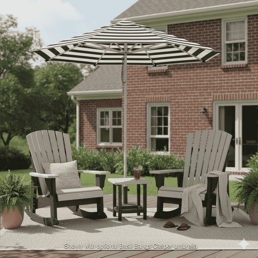 Outdoor patio set with two Krahn poly rockers and a striped basil bangsumbrella in front of a brick house