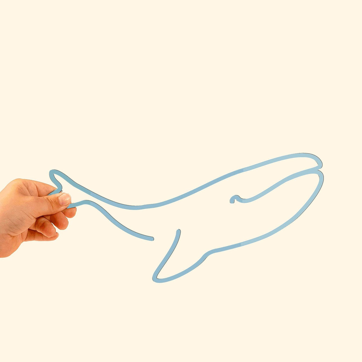 The Whale Line: Graceful metal silhouette featuring a whimsical whale, perfect for adding charm to kids&#39; spaces.